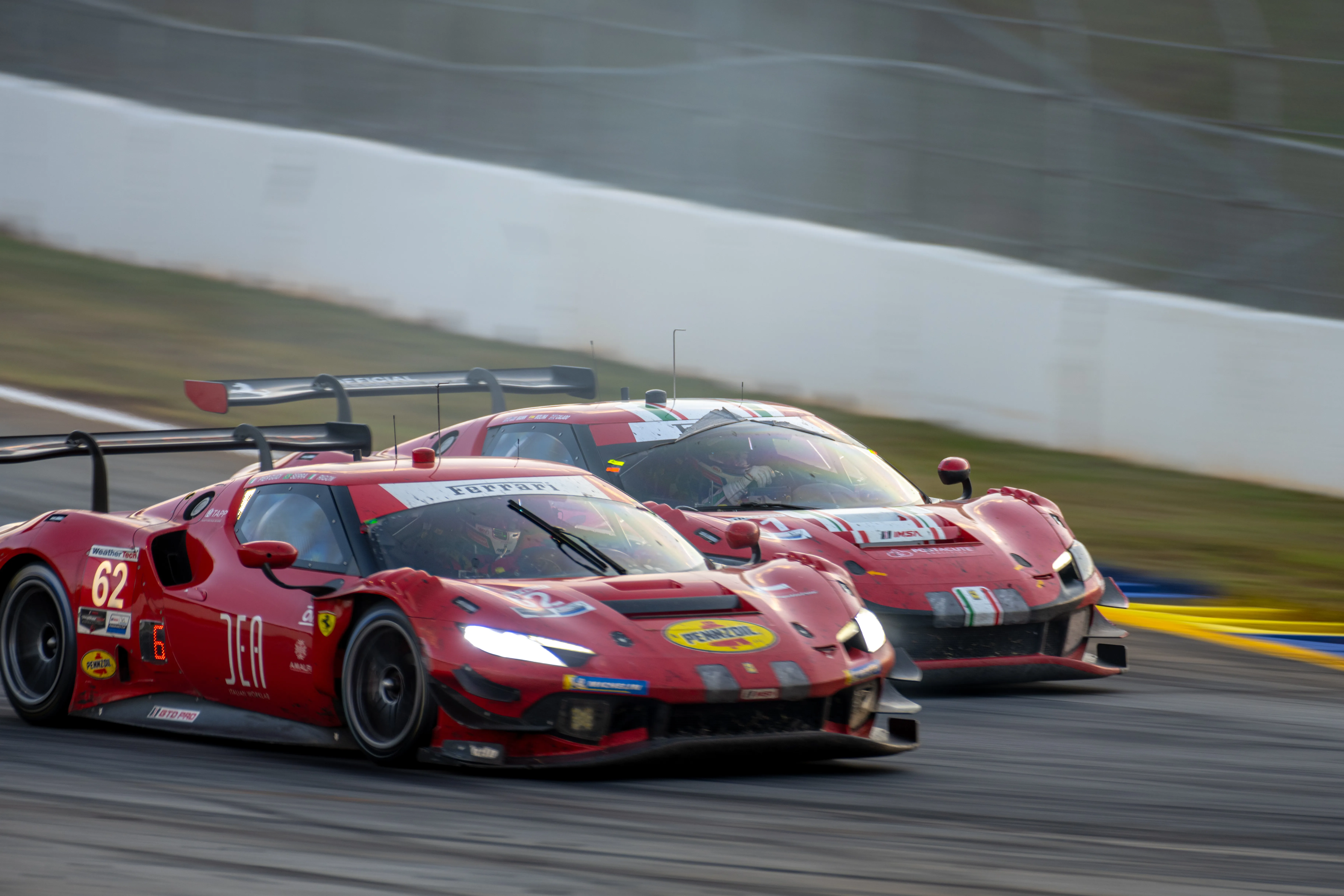 Two Ferrari 296 GT3 cars racing during Petit Le Mans