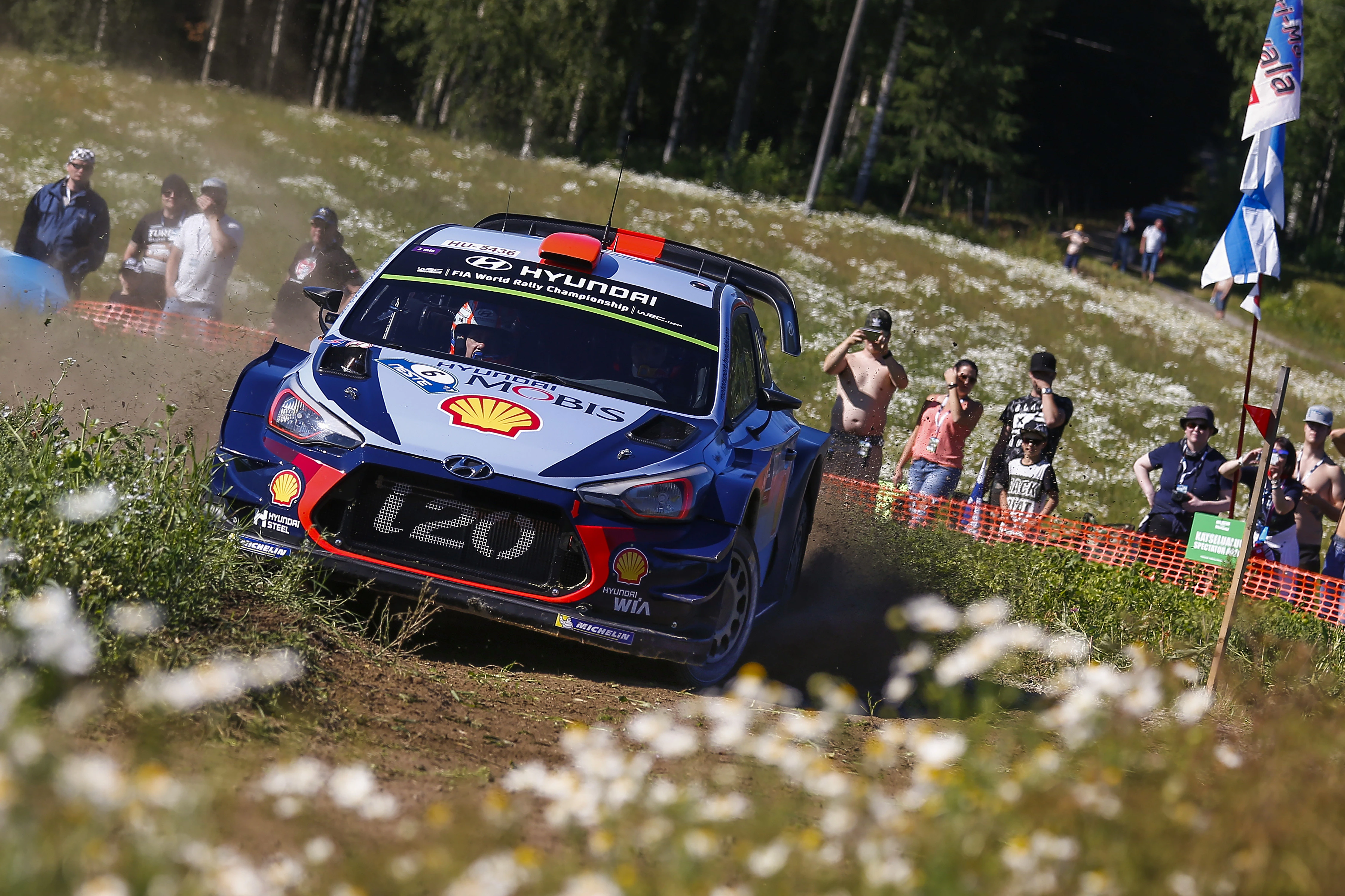 Rally car jumping on a gravel special stage at Rally Finland