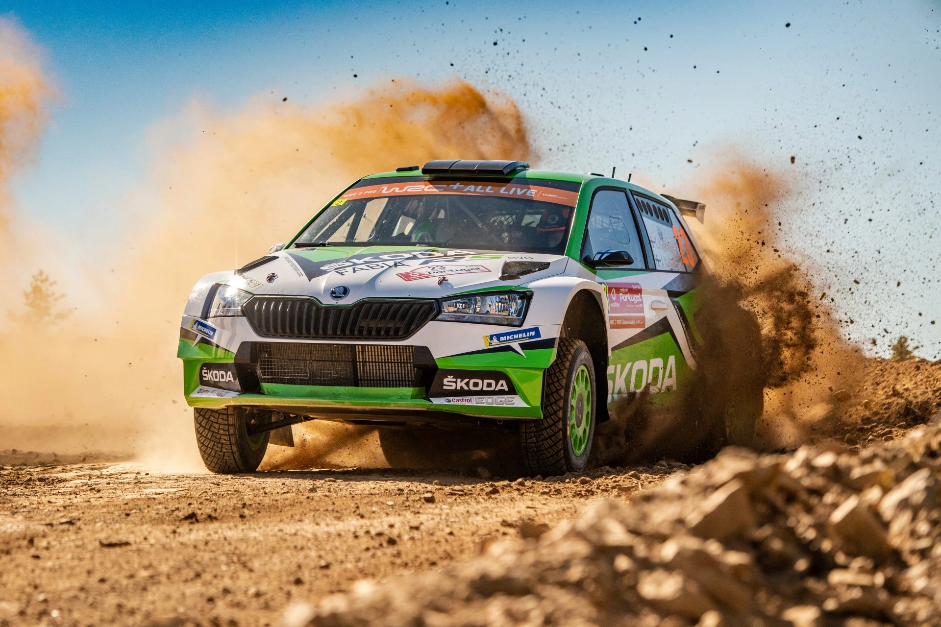 Rally car on stage with driver and co-driver working together